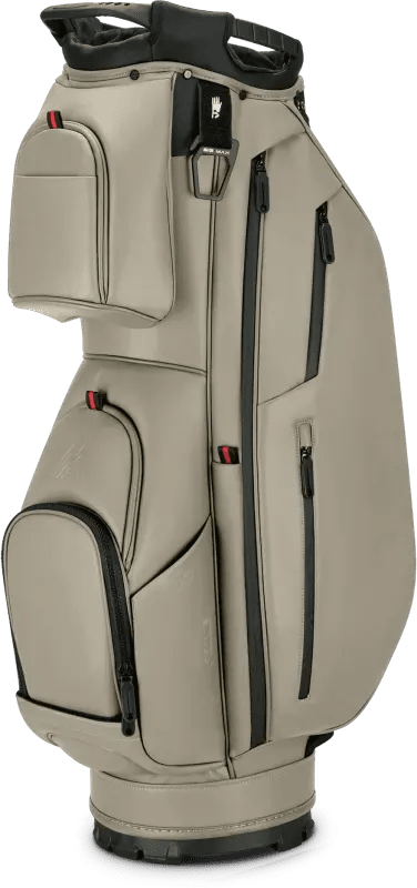 Taupefarbene Big Max Dri Lite Prime Cartbag mit mehreren Reißverschlusstaschen und schwarzem Akzent am Griff.