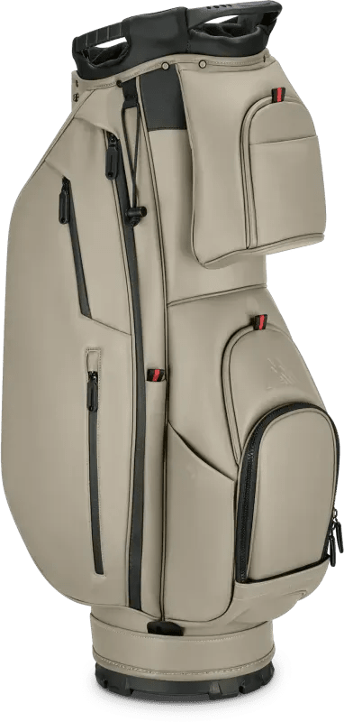 Taupefarbenes Big Max Dri Lite Prime Cartbag mit mehreren Reißverschlusstaschen und schwarzem Tragegriff.