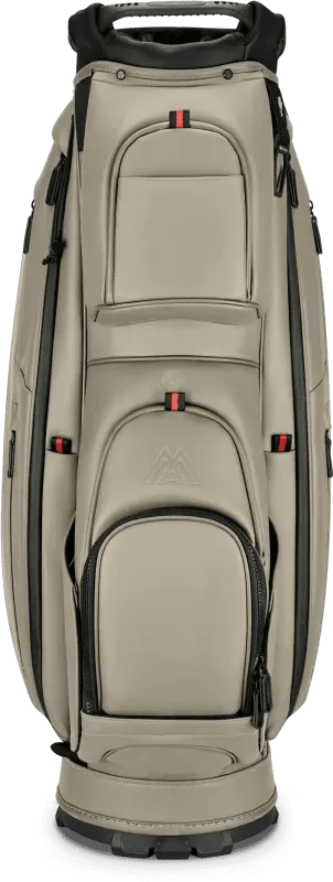 Taupefarbenes Big Max Dri Lite Prime Golf-Cartbag mit mehreren Reißverschlusstaschen und schwarzem Griff.