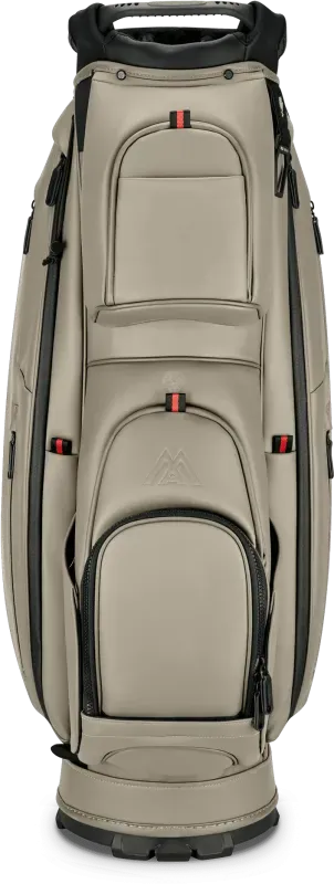 Taupefarbenes Big Max Dri Lite Prime Golf-Cartbag mit mehreren Reißverschlusstaschen und schwarzem Griff.