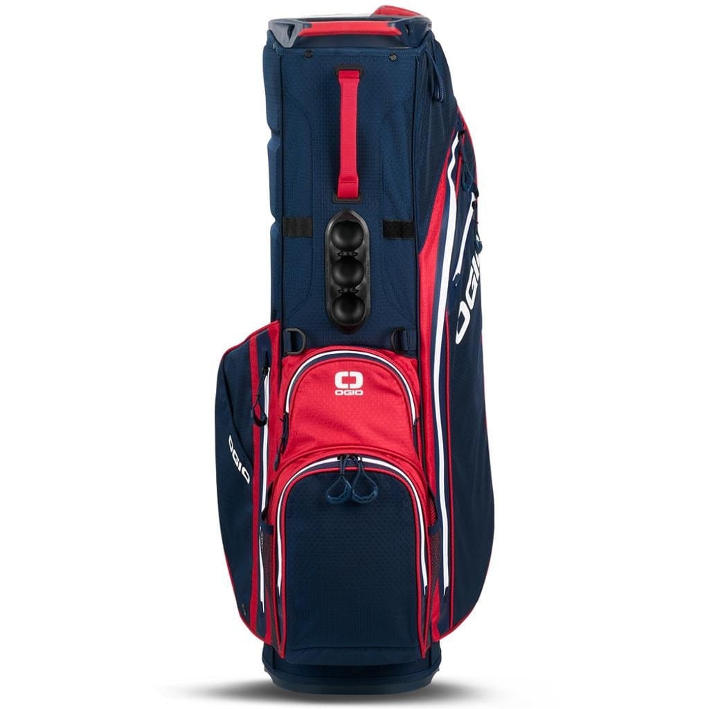 Golf-Standtasche in Navyblau mit roten Details, mehreren Reißverschlusstaschen und Tragegriff.