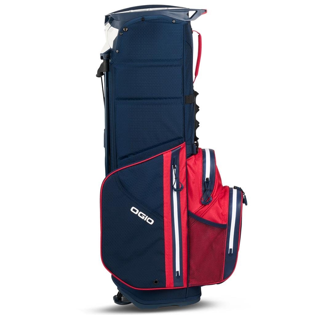 Golf-Standbag OGIO All Elements in Navyblau mit roten und weißen Akzenten, mehreren Taschen und Tragegriff.