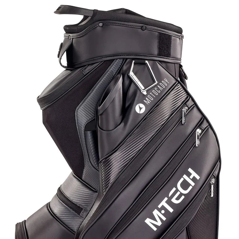 Schwarzes Motocaddy M-Tech Golf-Cartbag mit mehreren Reißverschlusstaschen und modernem Design.