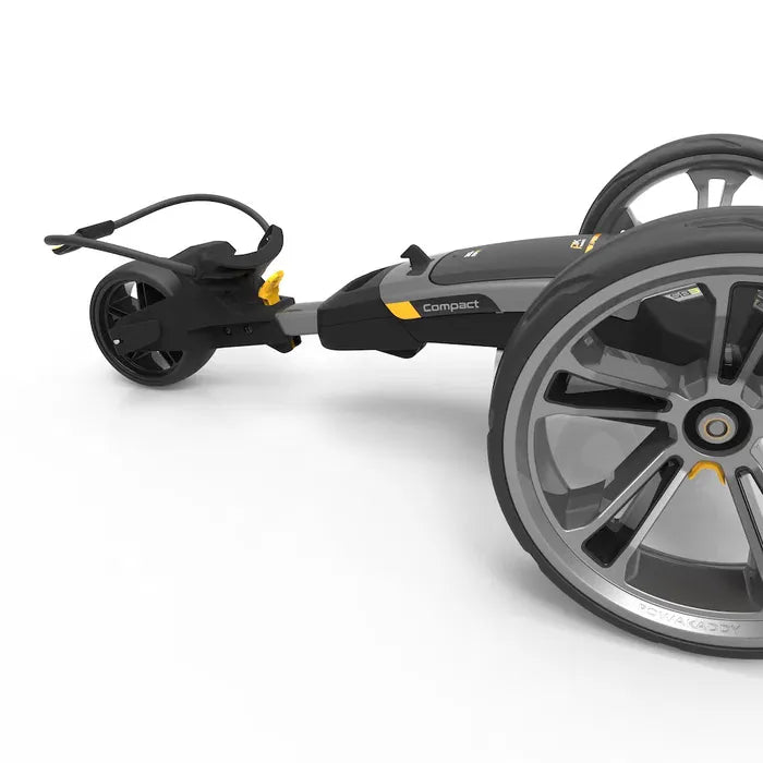 Schwarzer elektrischer Golftrolley mit großen grauen Rädern und gelben Akzenten, kompakter Rahmen.