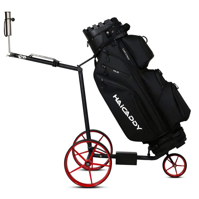 Schwarzer elektrischer Golftrolley Haicaddy HC9 mit roten Rädern und schwarzem Golfbag.