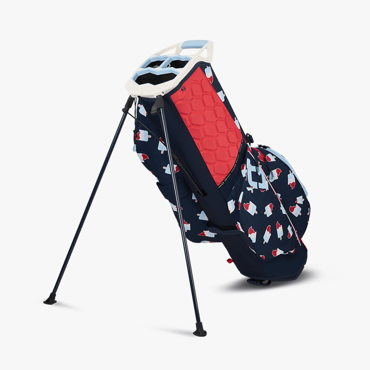 Golf-Standtasche OGIO Fuse 2025 in Rot-Weiß-Blau mit mehrfachem Stauraum und Stativbeinen.
